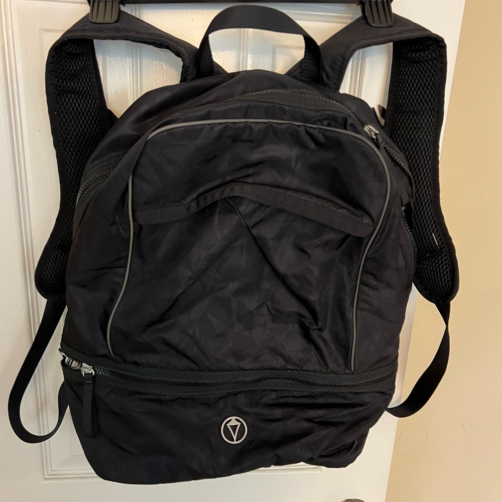Ivivva Girls black and white backpack. Lightly used in good condition